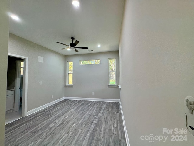 unfurnished room featuring ceiling fan and wood-type flooring