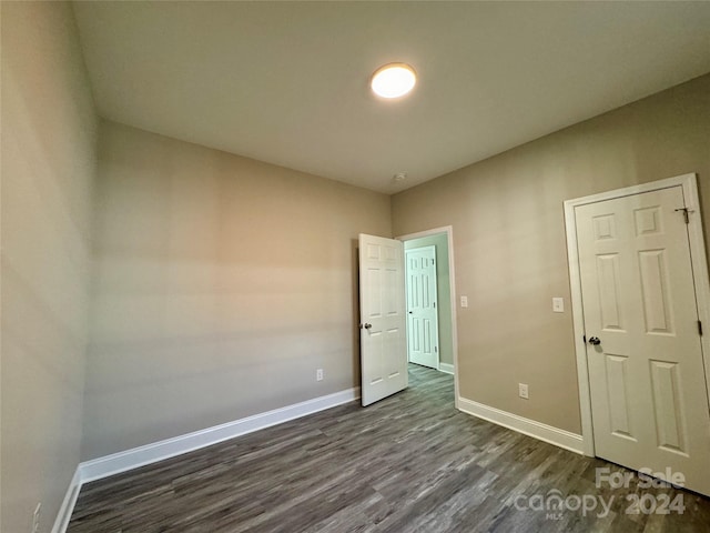 empty room featuring dark hardwood / wood-style floors