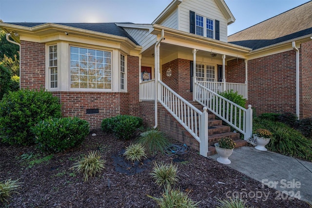 property entrance with a porch