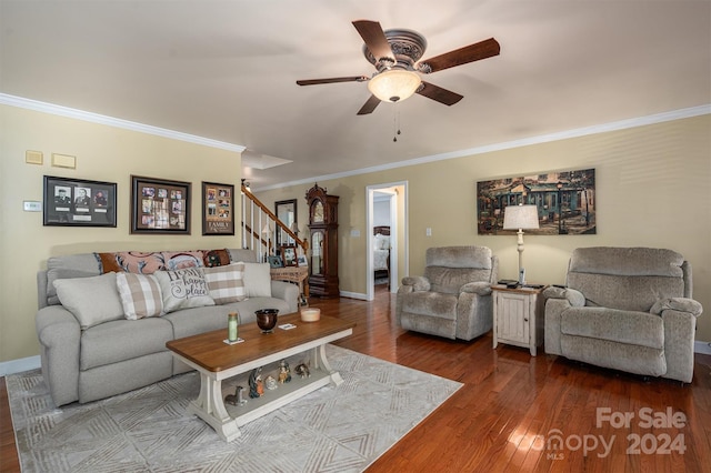 living room featuring crown molding, hardwood / wood-style flooring, and ceiling fan