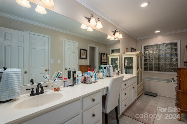 bathroom featuring vanity, a chandelier, ornamental molding, and a bathing tub