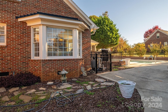 view of side of home with a patio