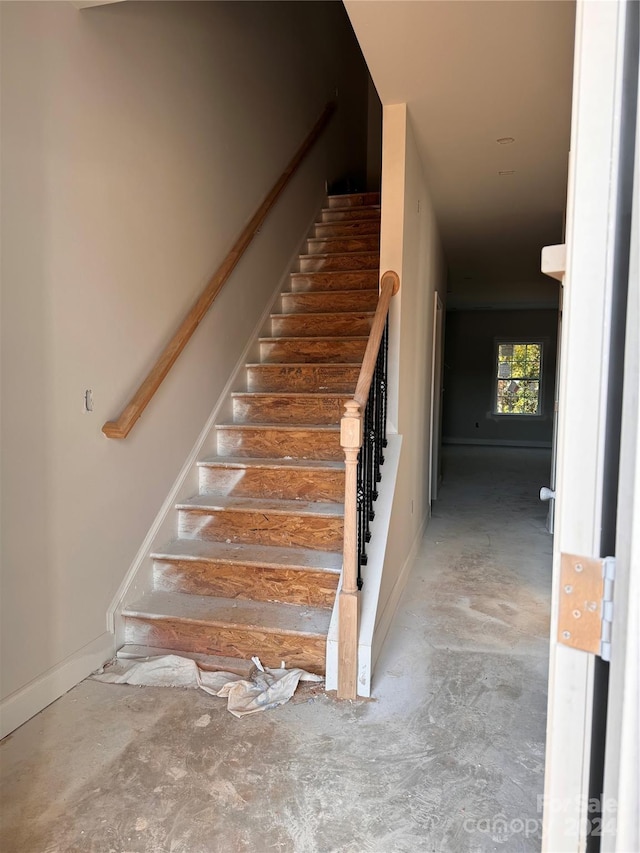 4057 Port Richmond Ave Unit 13, Gastonia, NC 28056 - staircase featuring baseboards and concrete flooring