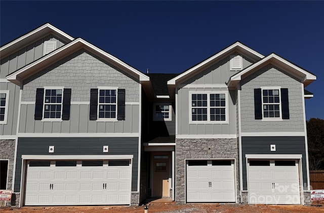 4057 Port Richmond Ave Unit 13, Gastonia, NC 28056 - view of property featuring a garage, stone siding, board and batten siding, and driveway