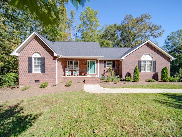 ranch-style home with a porch and a front lawn