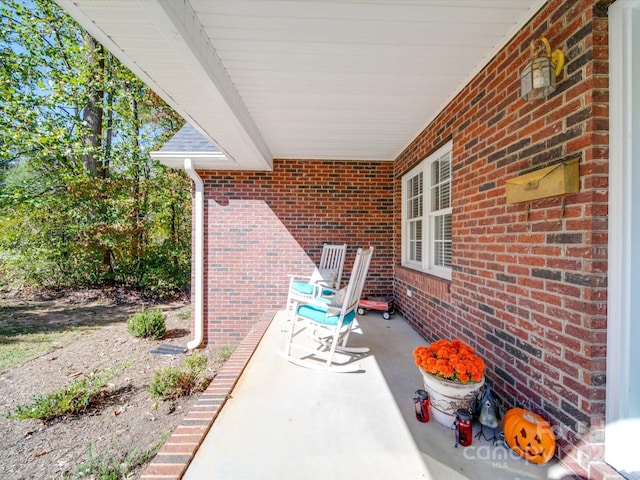 view of patio featuring a porch