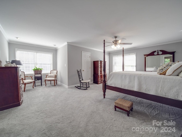 carpeted bedroom featuring multiple windows, ornamental molding, and ceiling fan