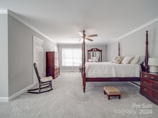 bedroom with ceiling fan, ornamental molding, and carpet floors