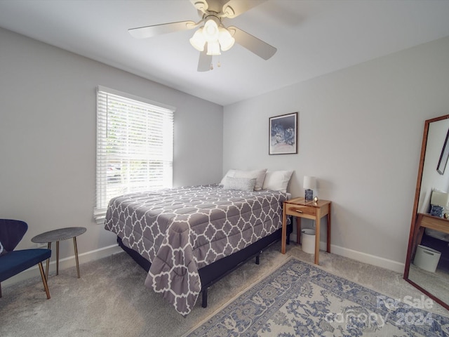 bedroom with ceiling fan and carpet floors