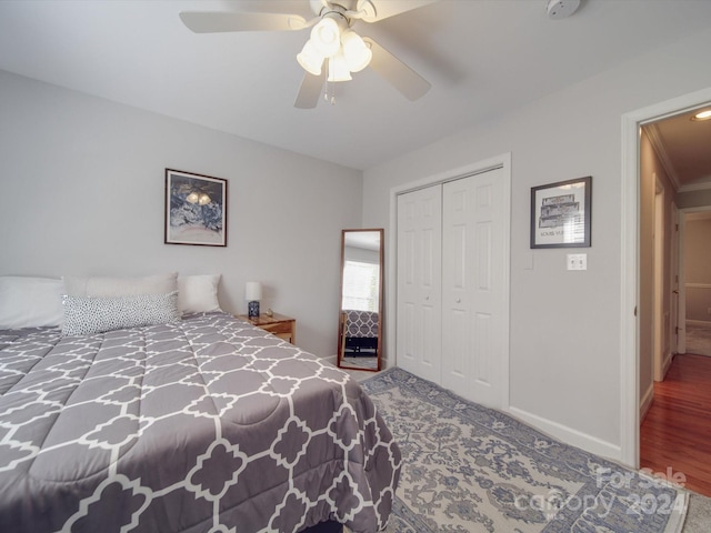 bedroom featuring a closet, ceiling fan, and wood-type flooring