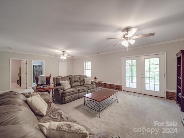 living room featuring french doors, ceiling fan, light carpet, and crown molding