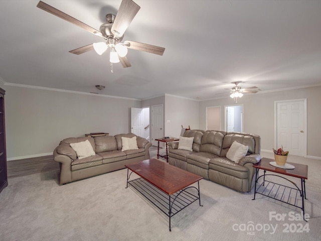 carpeted living room with crown molding and ceiling fan