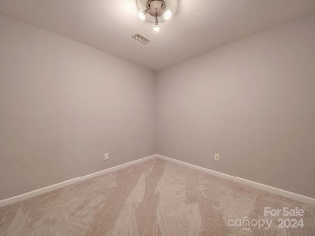 unfurnished room featuring carpet floors