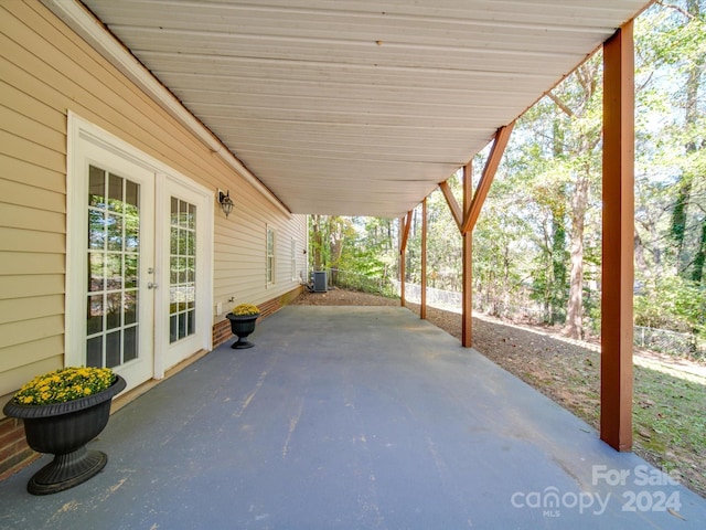 view of patio featuring french doors and cooling unit