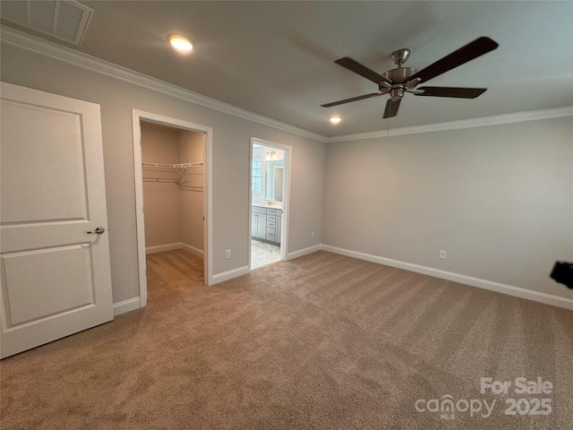 4049 Port Richmond Ave Unit 11, Gastonia, NC 28056 - unfurnished bedroom with light colored carpet, crown molding, visible vents, and a walk in closet