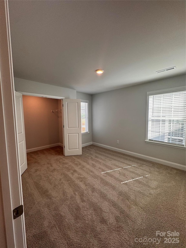 4049 Port Richmond Ave Unit 11, Gastonia, NC 28056 - unfurnished bedroom with baseboards, carpet flooring, and visible vents