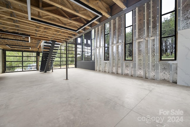 interior space featuring concrete flooring and plenty of natural light