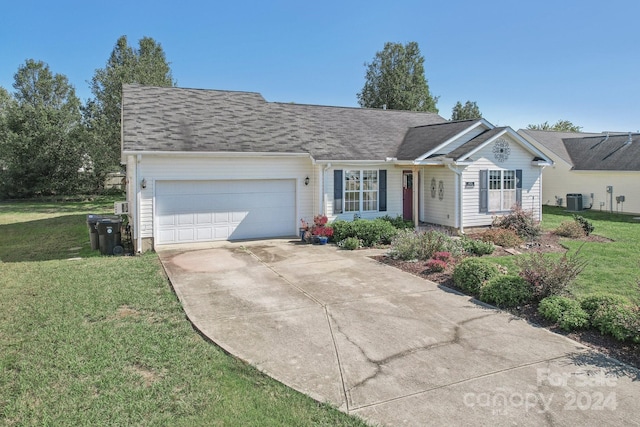 single story home with cooling unit, a front lawn, and a garage