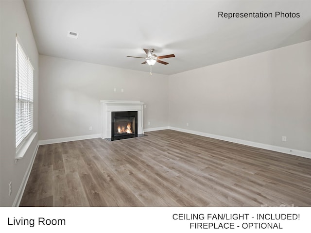 209 Lake George Dr, Shelby, NC 28152 - unfurnished living room with visible vents, a fireplace with flush hearth, wood finished floors, baseboards, and a ceiling fan