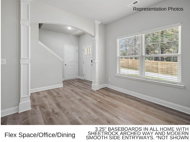 209 Lake George Dr, Shelby, NC 28152 - interior space featuring visible vents, arched walkways, baseboards, and wood finished floors