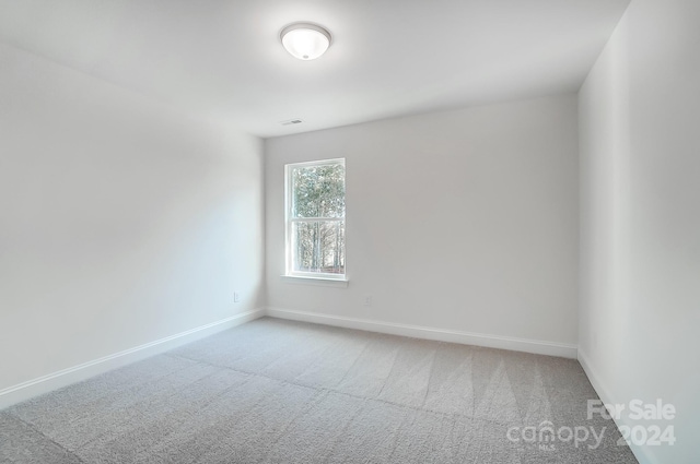 empty room featuring carpet floors