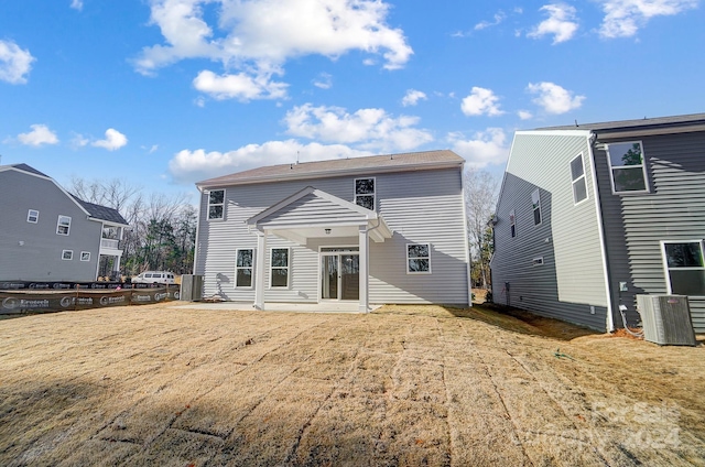 rear view of property with central air condition unit