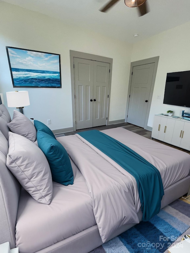 bedroom with ceiling fan and a closet