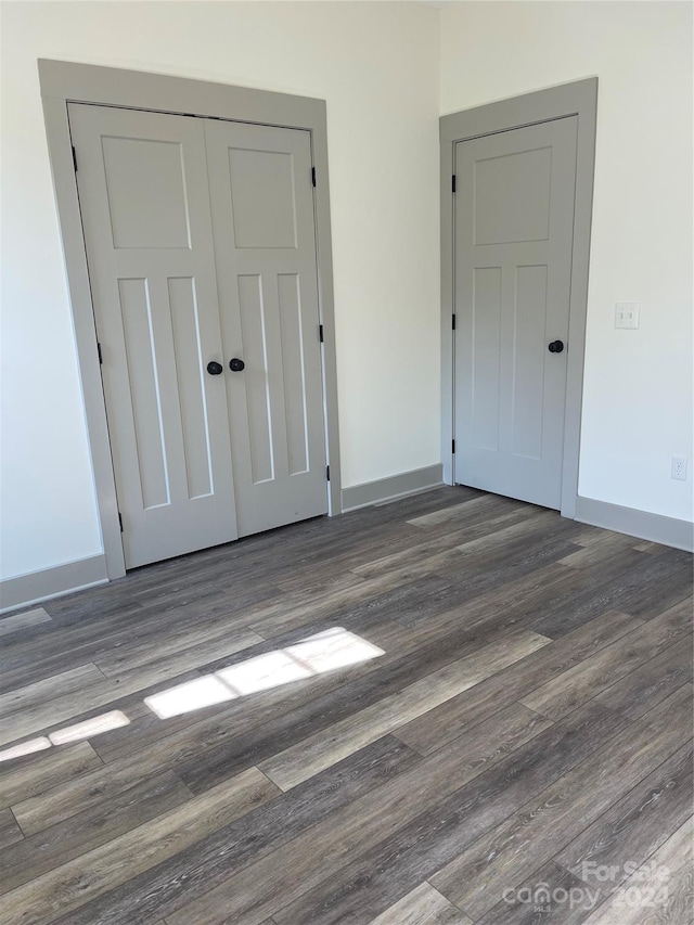 spare room featuring dark hardwood / wood-style floors