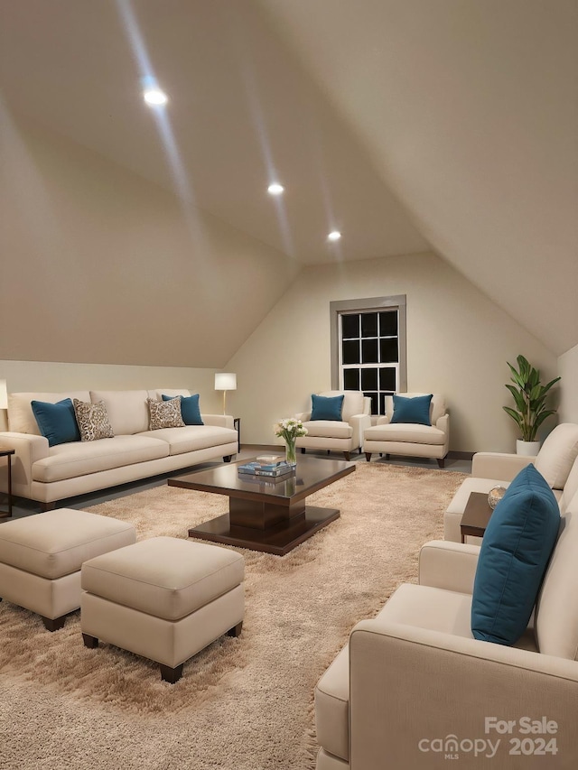 carpeted living room featuring lofted ceiling