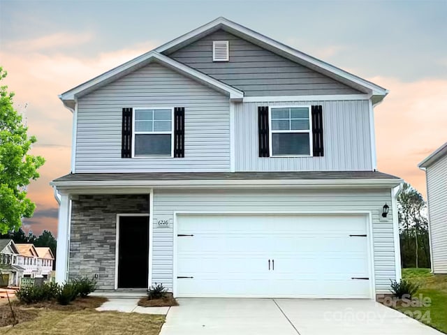 front of property with a garage