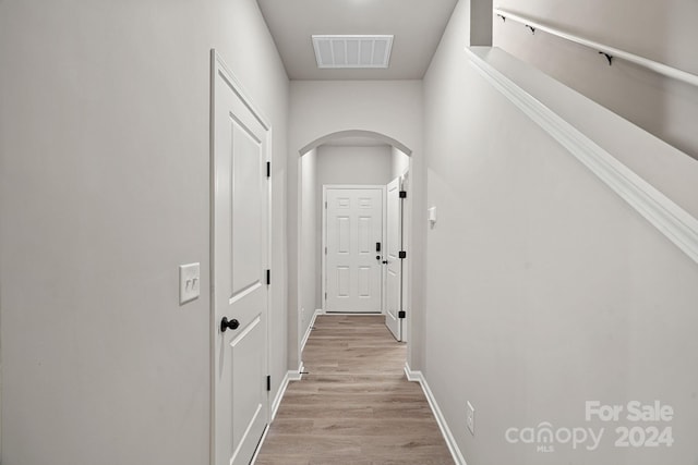 corridor featuring light hardwood / wood-style floors