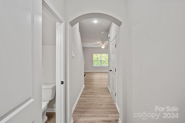 hall with light hardwood / wood-style flooring