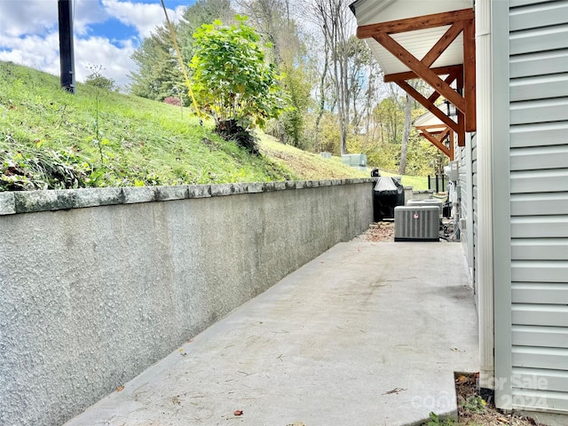 view of patio with central AC unit