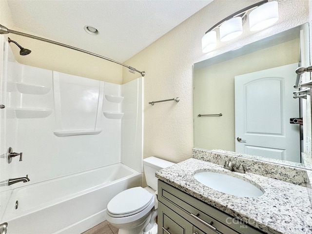 full bathroom featuring vanity, a textured ceiling, toilet, and tub / shower combination