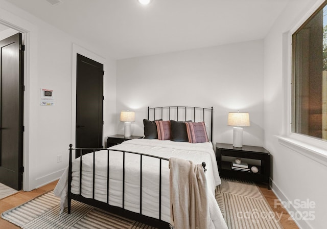 bedroom featuring hardwood / wood-style floors