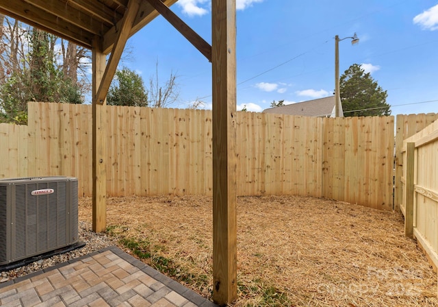 view of yard featuring a patio and central AC unit