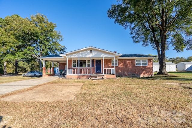 view of front of property with covered porch, a carport, and a front lawn