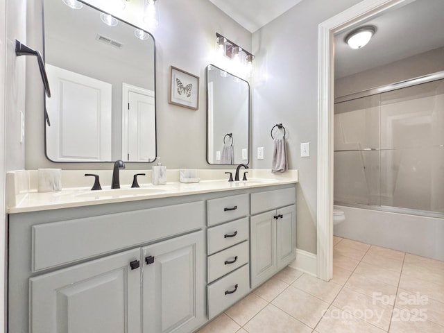 full bathroom with toilet, vanity, tile patterned flooring, and shower / bath combination with glass door