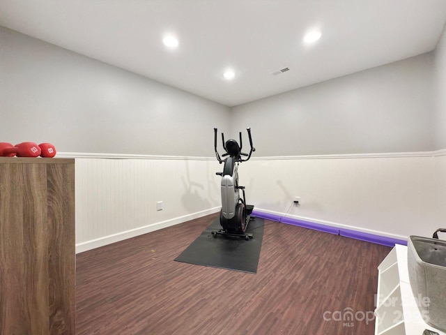 workout room with dark wood-type flooring