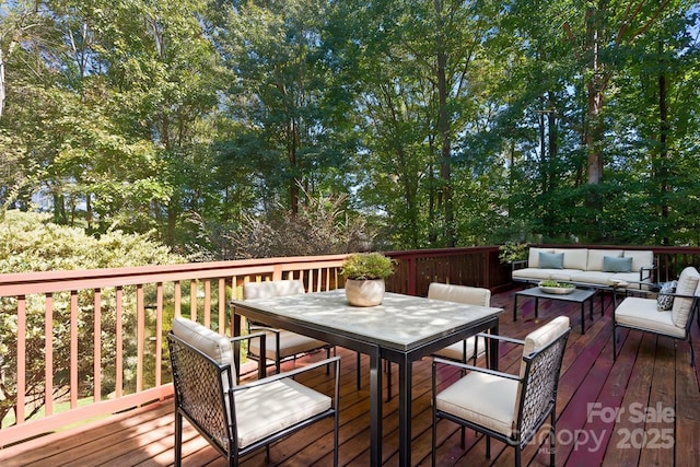 wooden terrace with outdoor lounge area