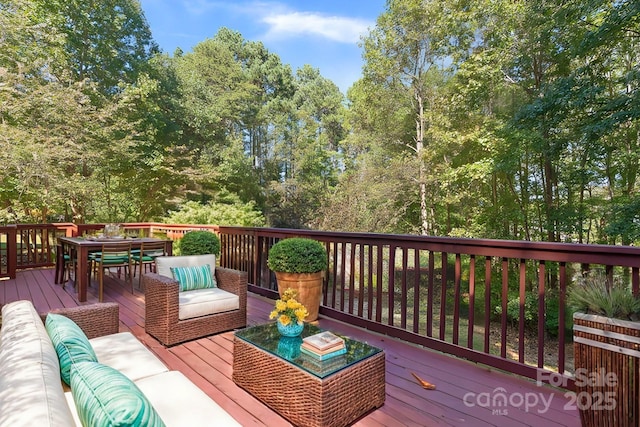 deck featuring outdoor lounge area