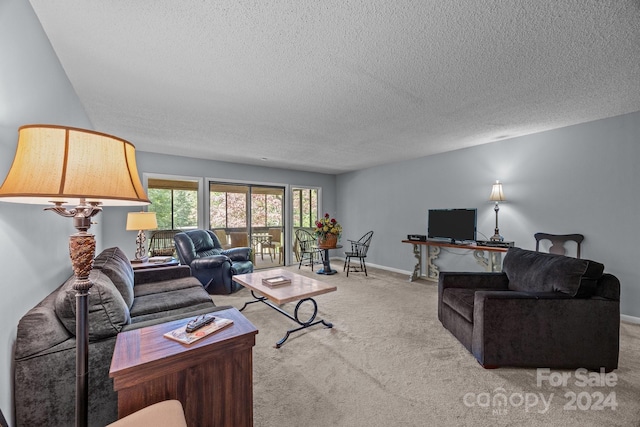 living room with light carpet and a textured ceiling