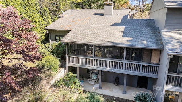 back of house with a patio and a sunroom