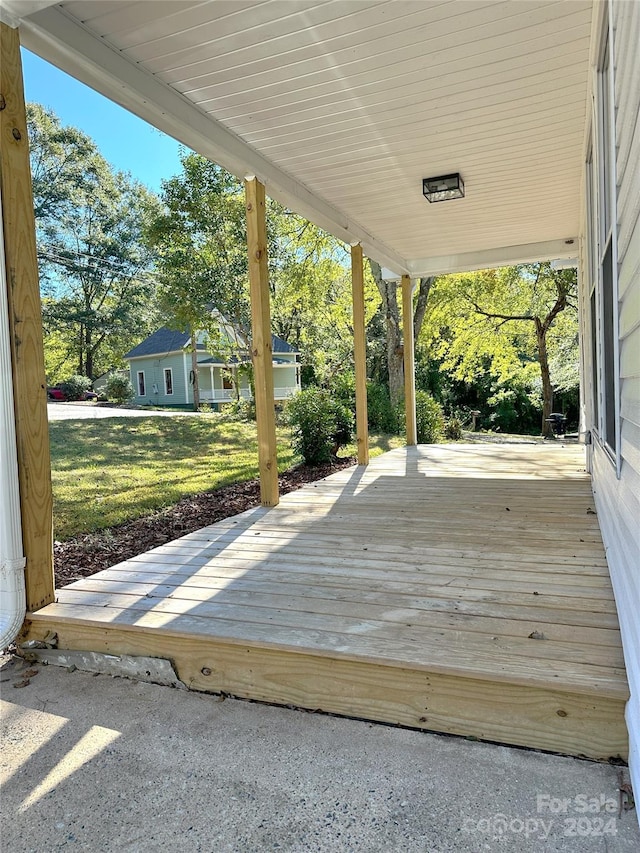 deck featuring a lawn