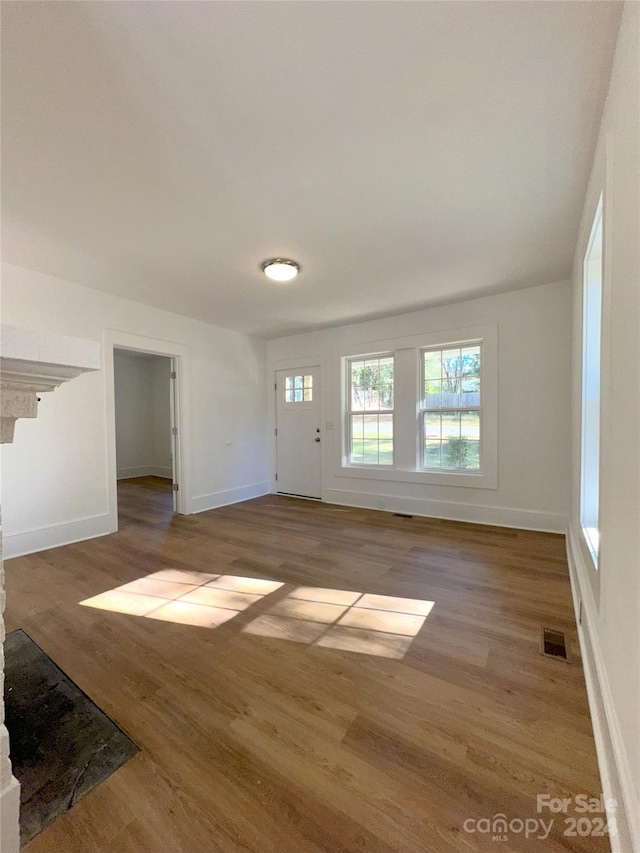 unfurnished living room with light hardwood / wood-style floors