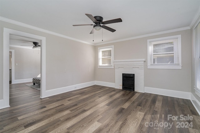 unfurnished living room with crown molding, dark hardwood / wood-style floors, and ceiling fan