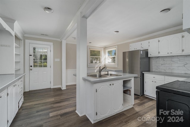 kitchen featuring a wealth of natural light, sink, and white cabinets