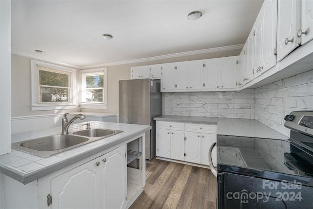 kitchen with white cabinetry, stainless steel appliances, sink, and dark hardwood / wood-style floors