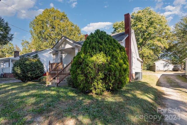 view of property exterior with a yard