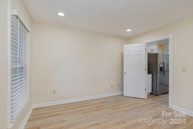 unfurnished room featuring light wood-type flooring